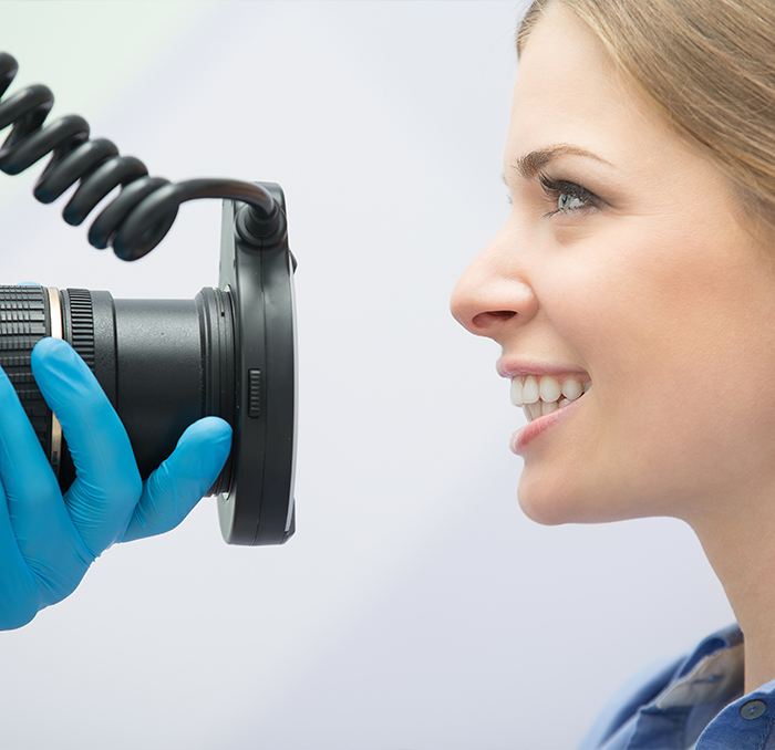 Dentist capturing smile photos for digital imaging