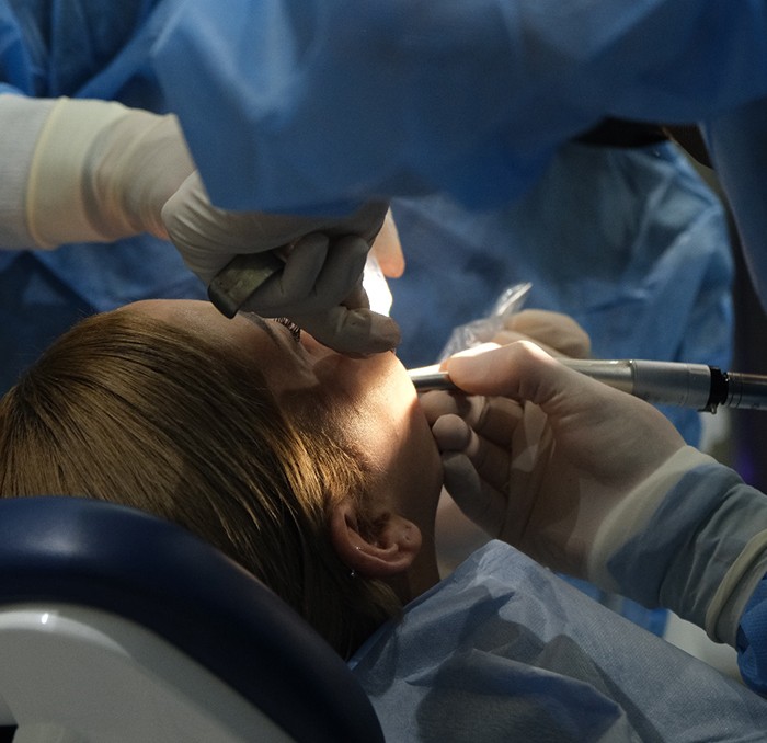 Woman getting oral surgery