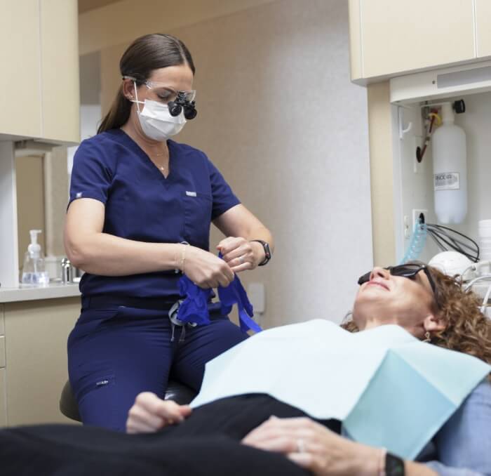 Dentist providing preventive dentistry checkup and teeth cleaning