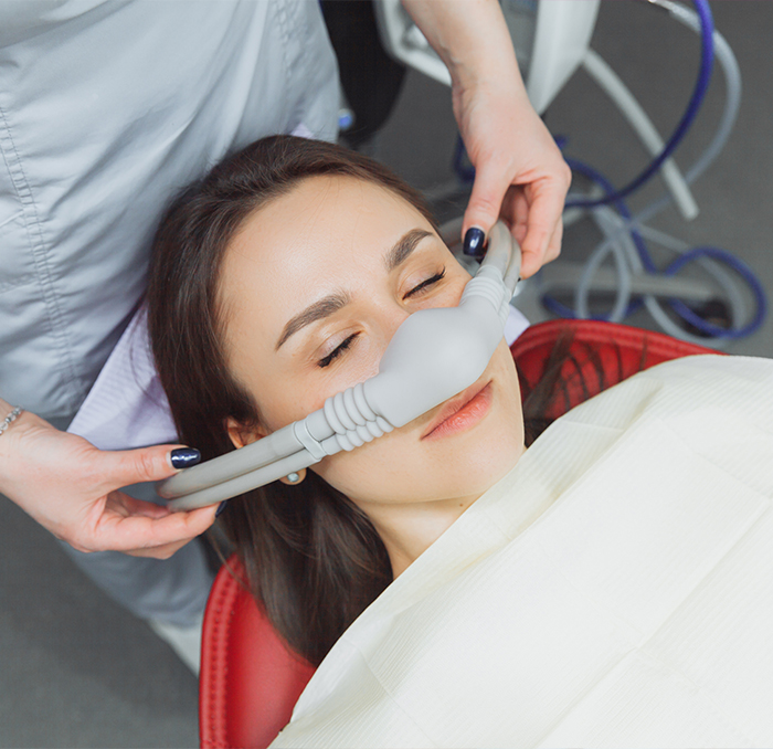 Dentistry patient relaxing during oral conscious dental sedation visit