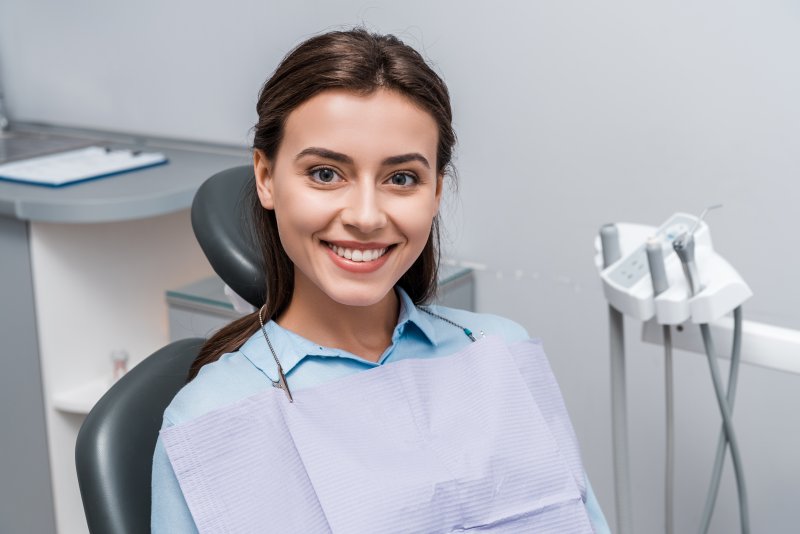 Female patient smiling in a dental chair