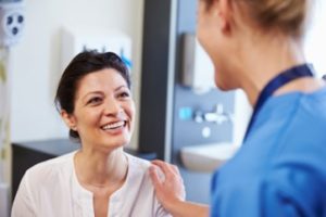 a patient visiting their dentist for a sinus lift