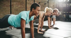 a woman smiling while exercising