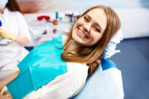 Woman smiling after her dental cleaning