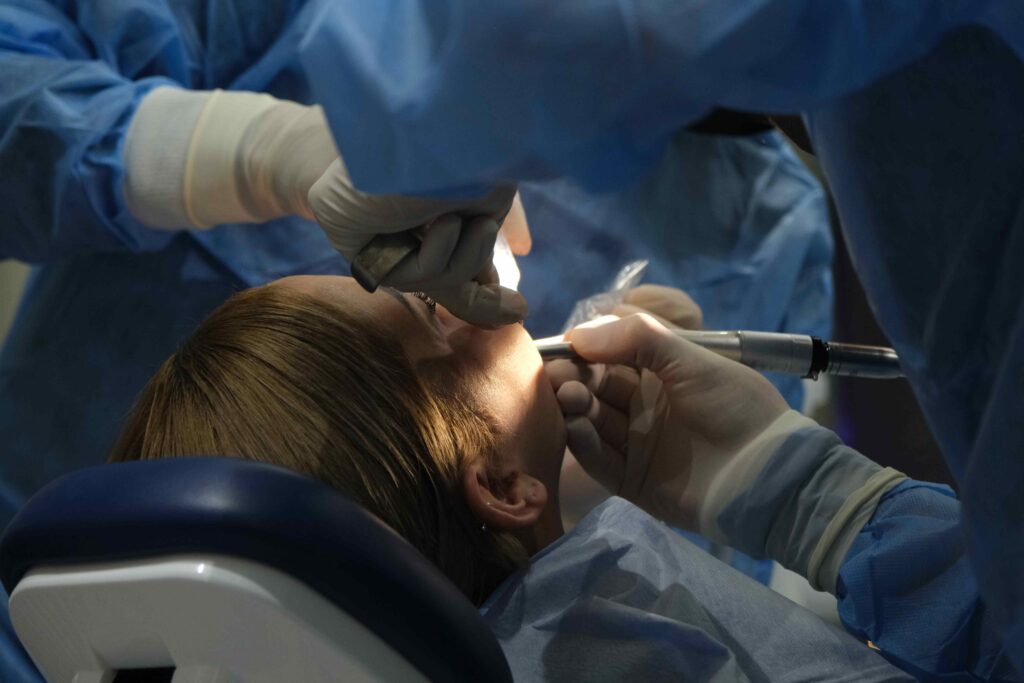 Woman getting dental surgery